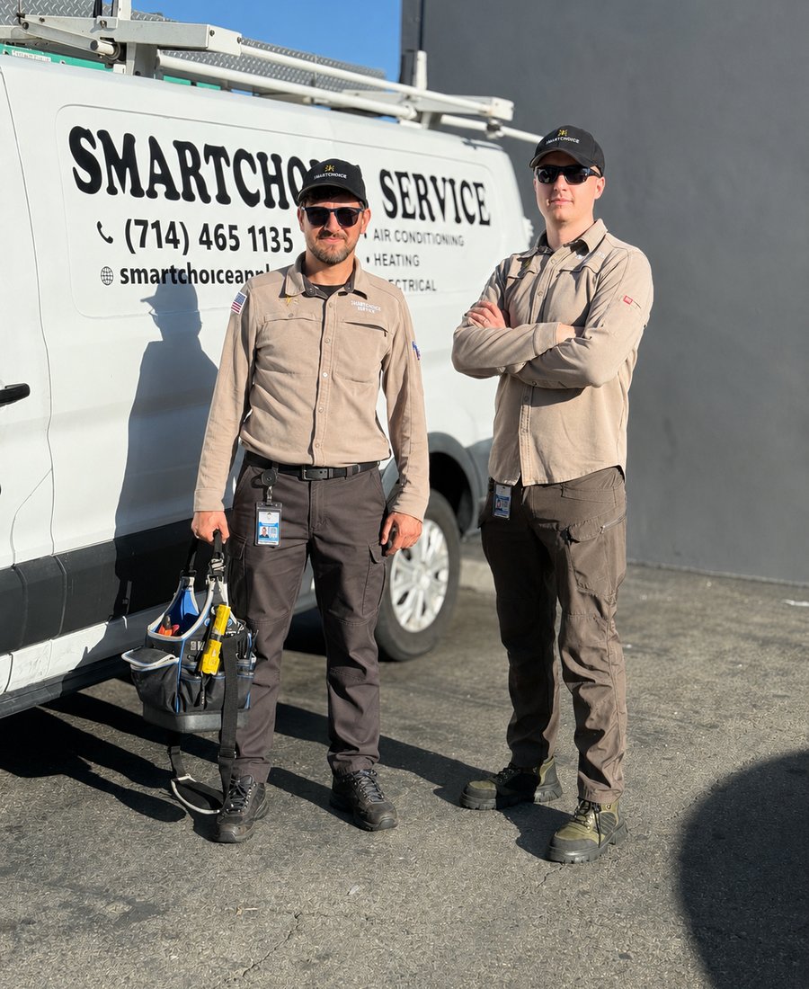 Smartchoice Service technicians in front of a branded company van in Orange County