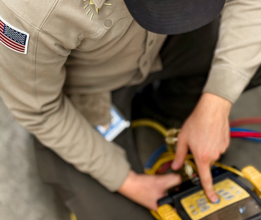 Smartchoice technician running gauges to diagnose an HVAC system